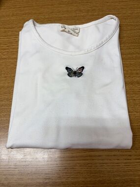 Classic White Short-Sleeve Top with Butterfly Detail